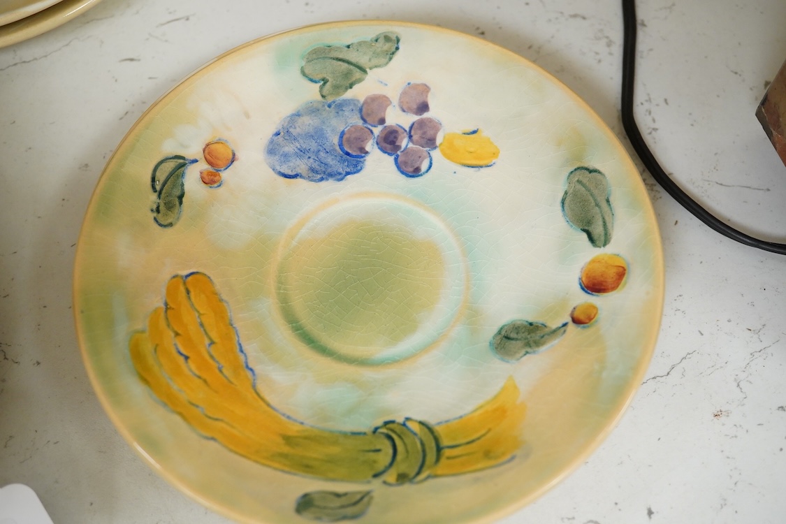 A collection of Doulton Brangwynware to include cups and saucers and a milk jug, largest 19cm in diameter